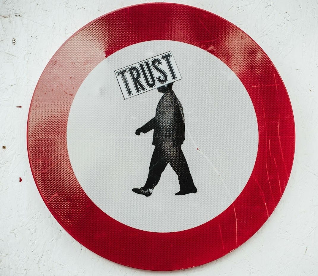 round red and white Trust signage round red and white Trust signage