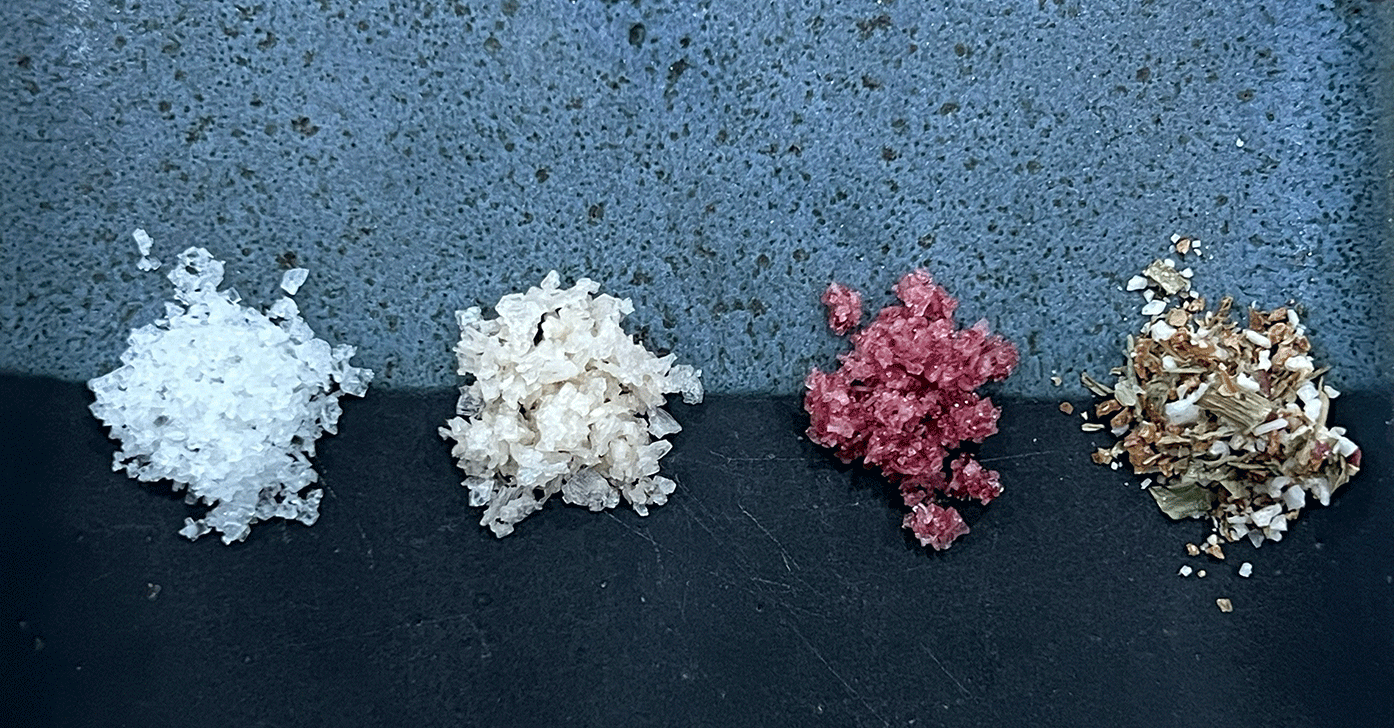 4 small piles of salt on a plate 