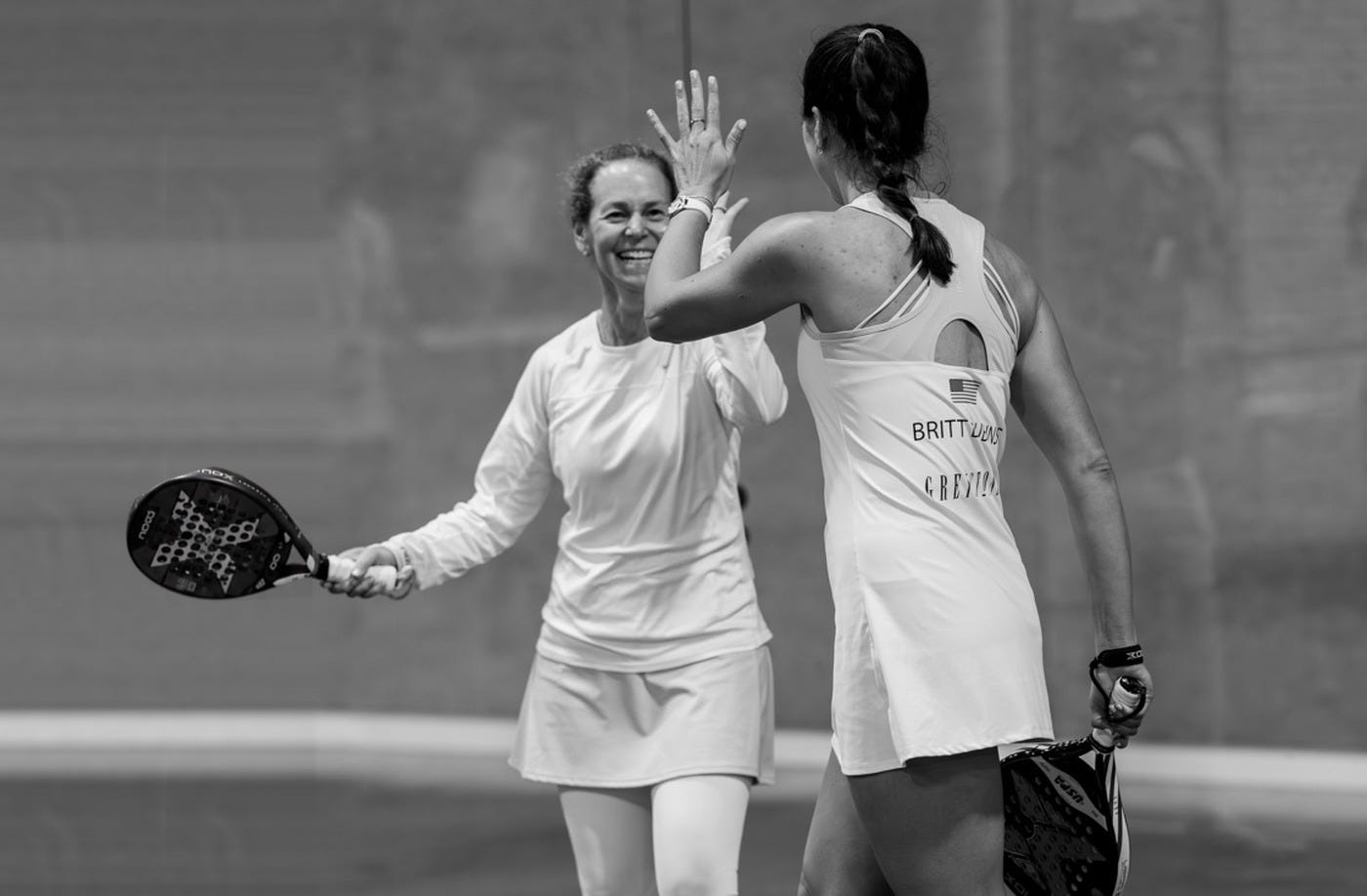 ōku founder Carolyn Hamlet on a padel court with U.S. No. 1 Brittany Dubins ōku founder Carolyn Hamlet on a padel court with U.S. No. 1 Brittany Dubins