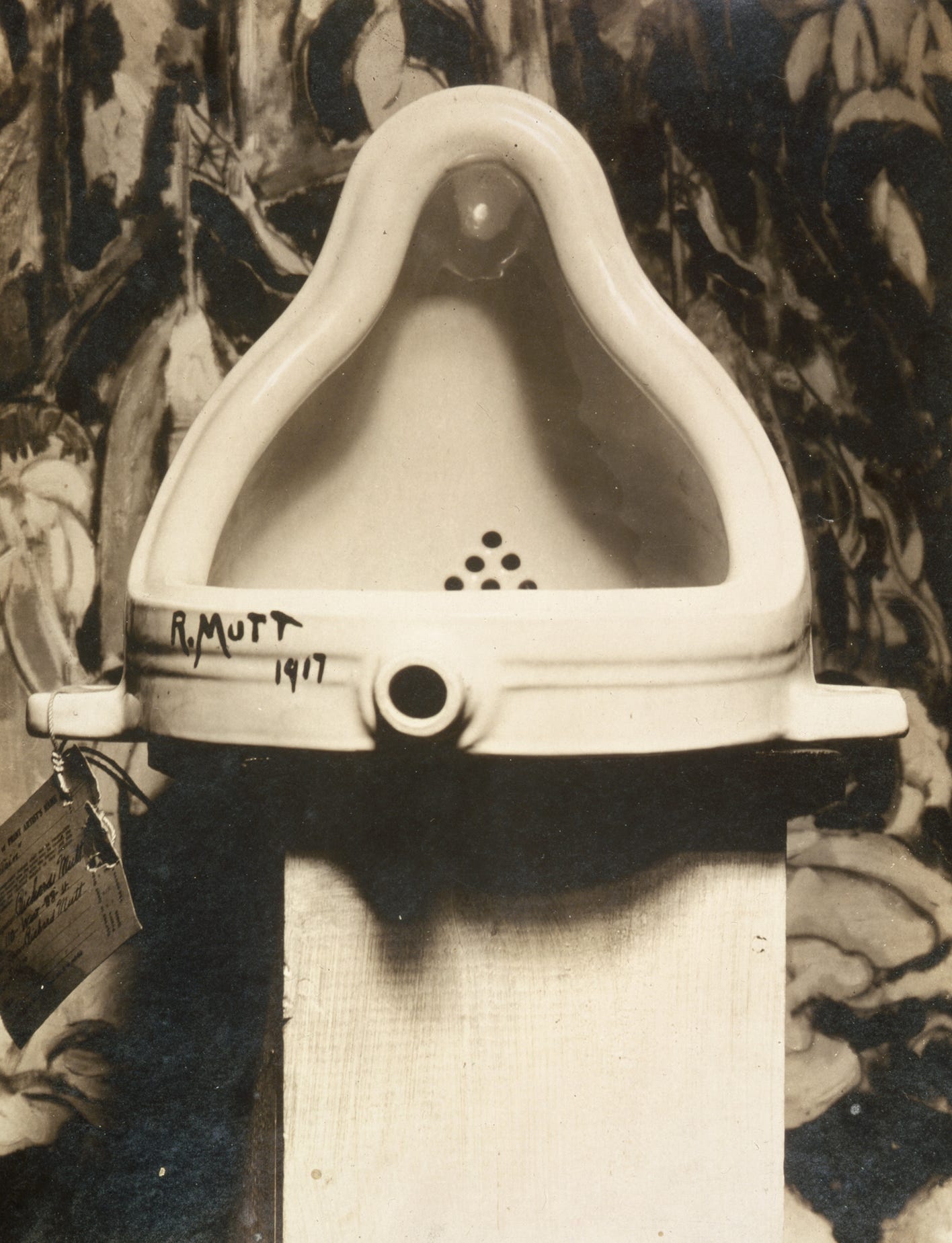 Photograph of Fountain, the porcelain urinal signed R Mutt, in a gallery corner Photograph of Fountain, the porcelain urinal signed R Mutt, in a gallery corner