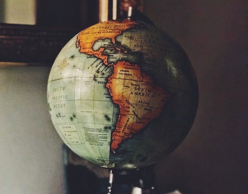 selective focus photo of desk globe