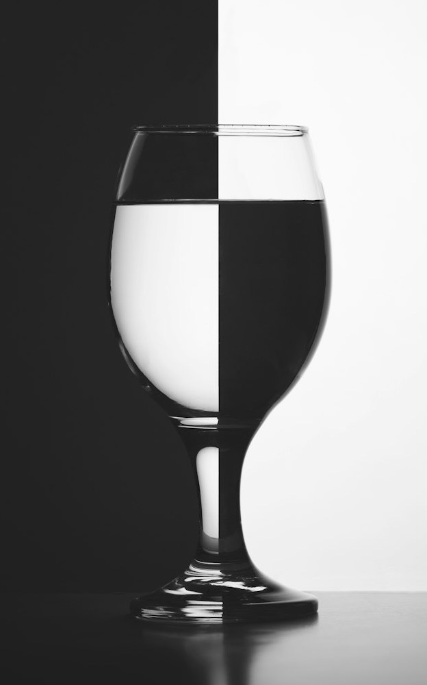 a black and white photo of a wine glass