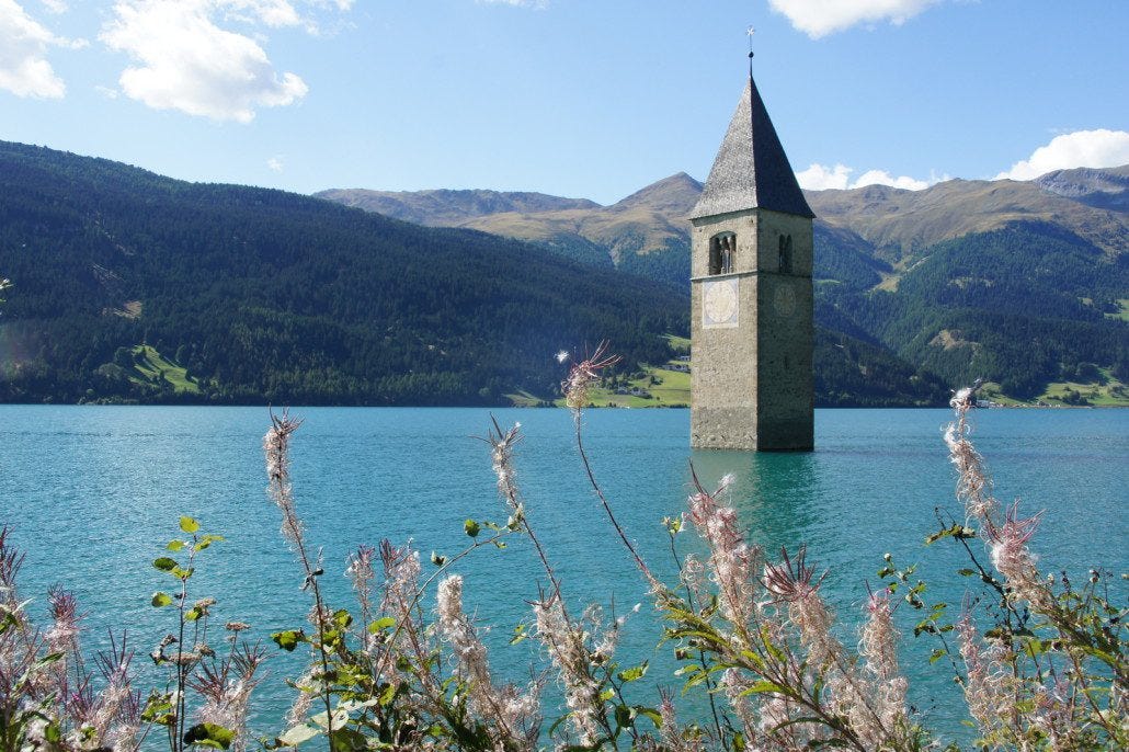 A flooded valley now sports this church spire in the middle of the lake. A flooded valley now sports this church spire in the middle of the lake.