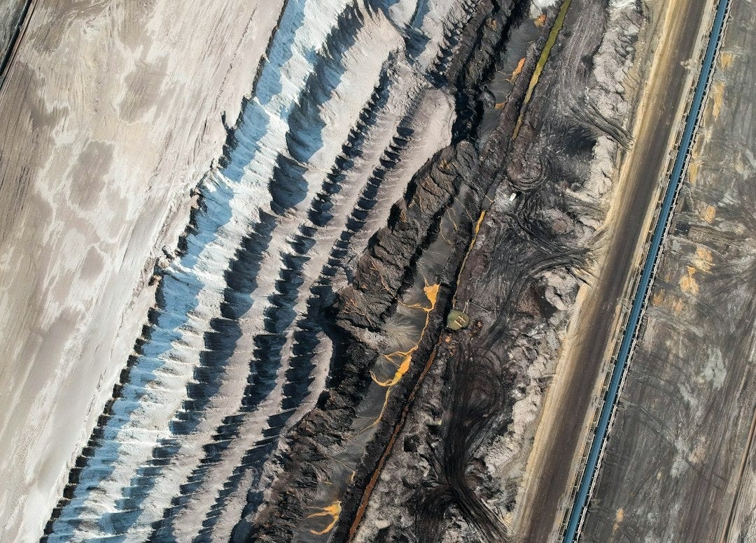 an aerial view of a train track in the desert