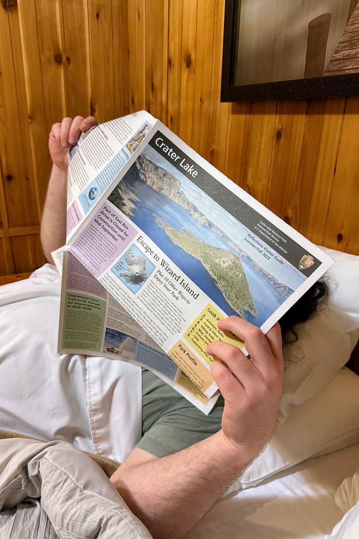 Golden mantel squirrel, phantom ship, Wizard Island, reading Crater Lake quarterly quide