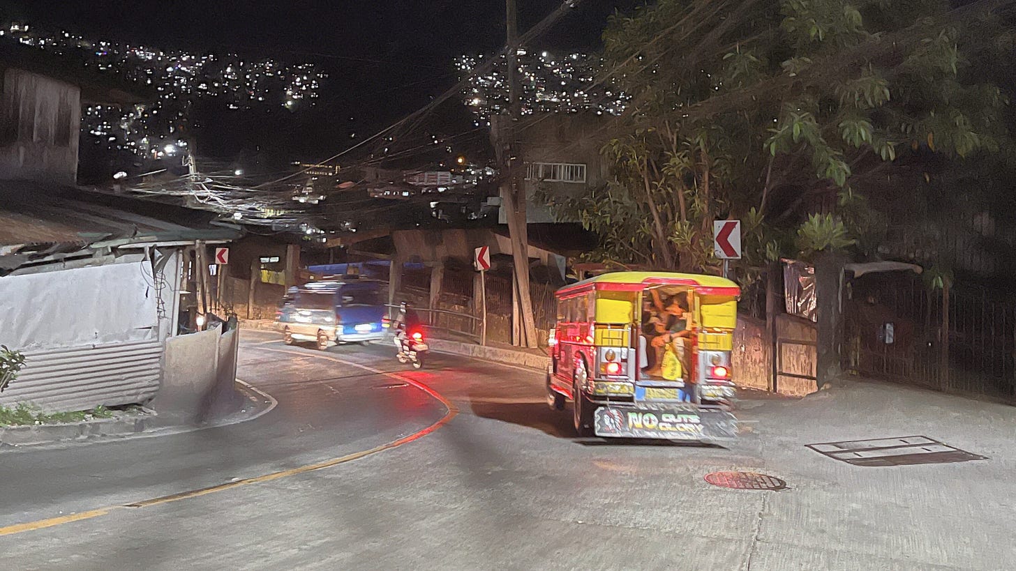 Winding road with jeepney