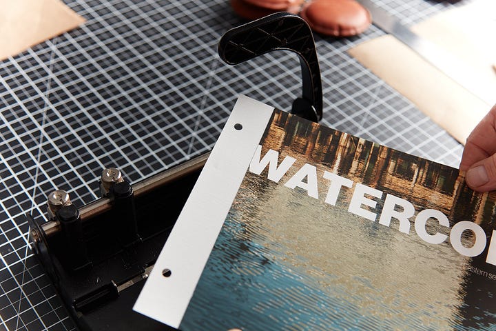 Gluing, triming, and punching a homemade linen hinge