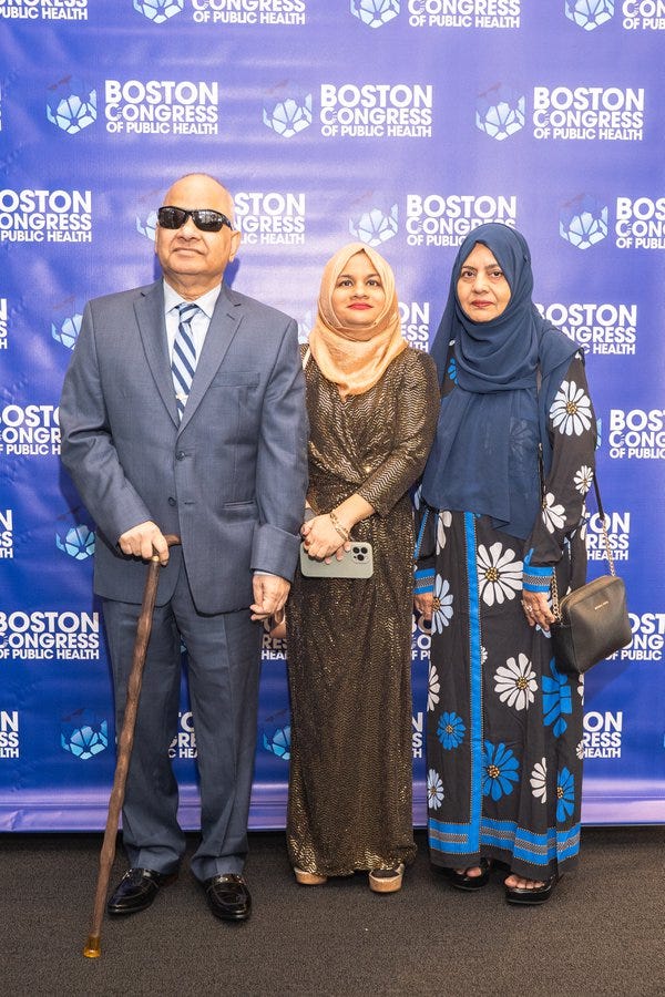 Musarrat Rahman, MPH, with family on the BCPH step-and-repeat.