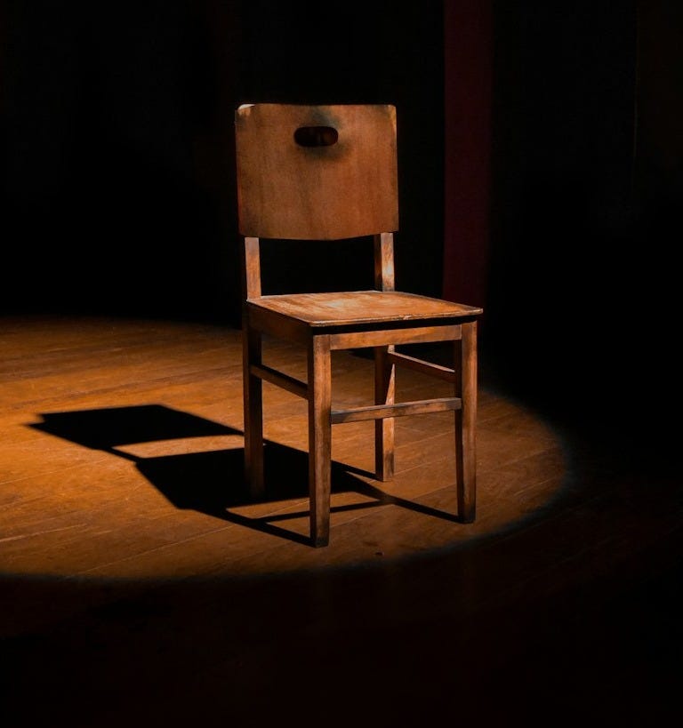 vacant brown wooden armless chair