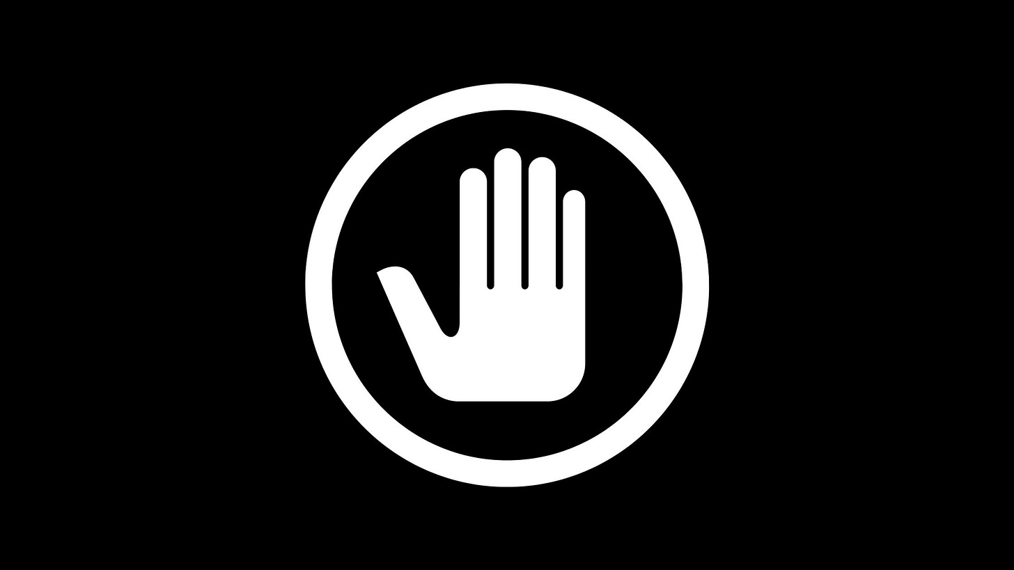 Image of black and white stop sign