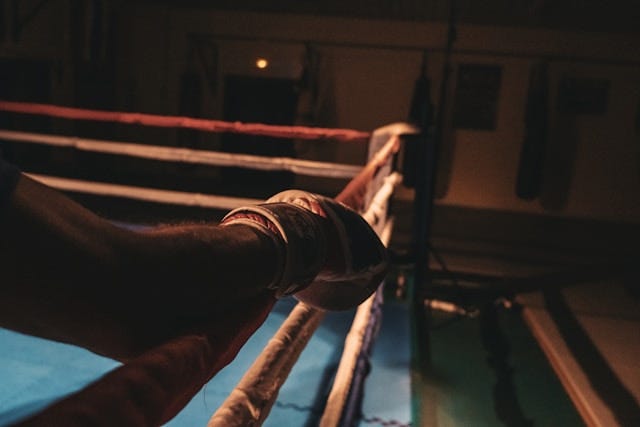 Man in boxing ring alone with right glove showing. Photo by Nemesia Production on Unsplash Man in boxing ring alone with right glove showing. Photo by Nemesia Production on Unsplash