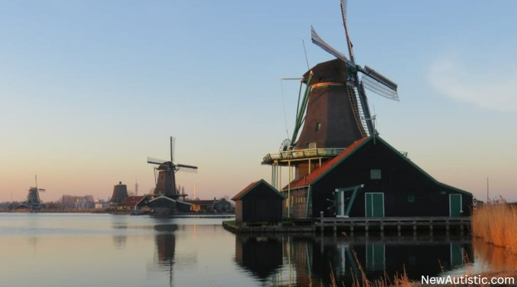 A photograph of some of the iconic windmills in the Netherlands.