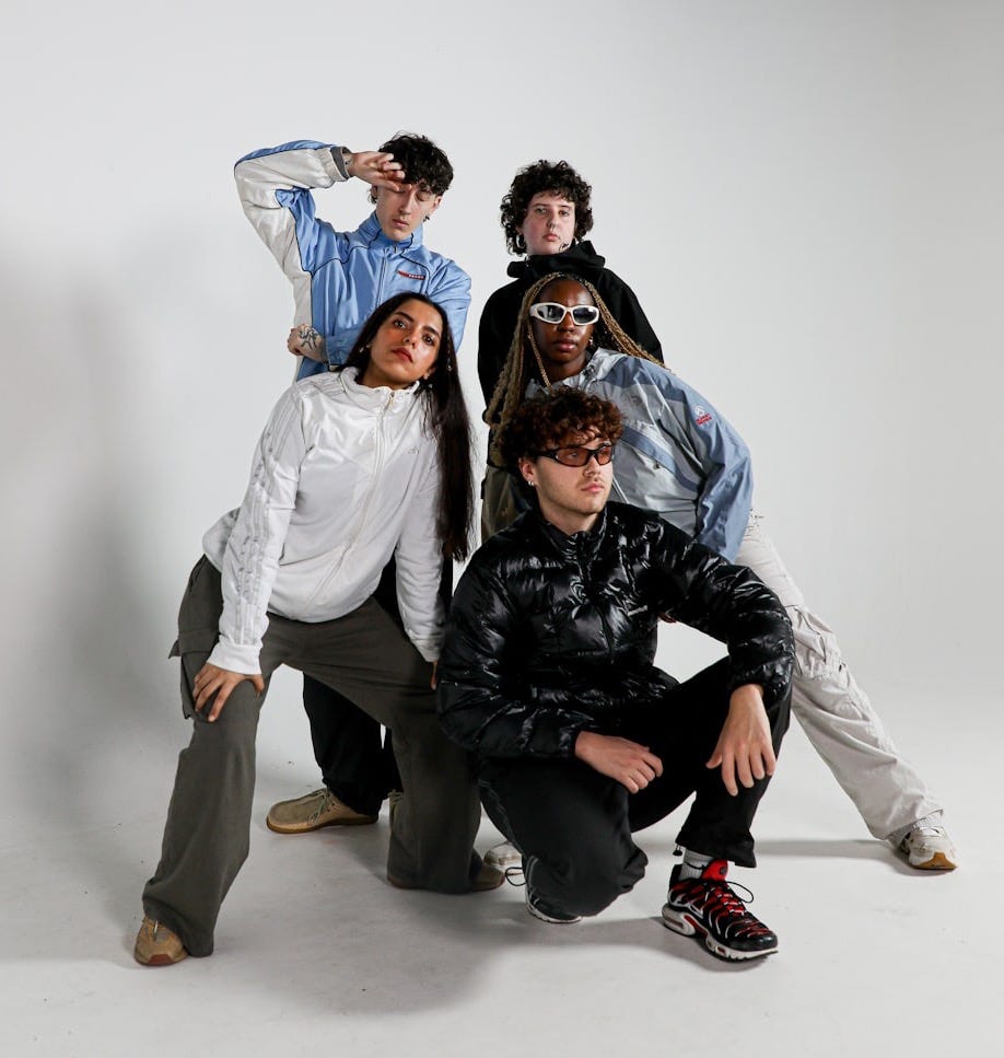 a group of young people posing for a picture