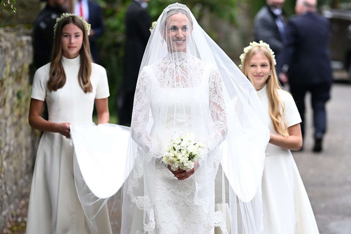 Harriet Sperling arrives for her Royal wedding to Peter Phillips followed by her bridesmaids Georgina Sperling and Isla Phillips at All Saints Church