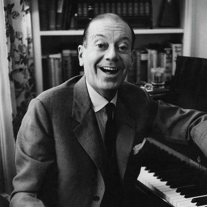 A person in a suit and tie sitting at a piano

AI-generated content may be incorrect.