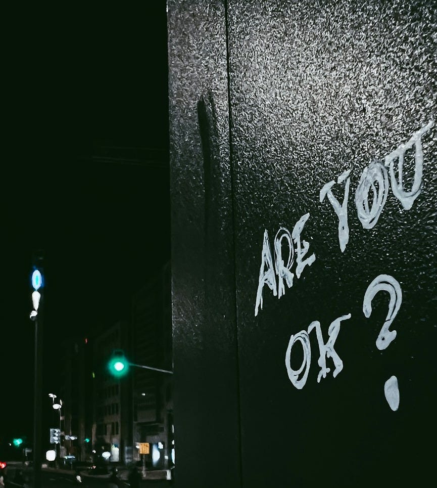 graffiti on the side of a building that says are you ok? graffiti on the side of a building that says are you ok?
