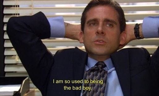 This may contain: a man sitting in an office chair with his hands on his head and the words i am so used to being the bad boy