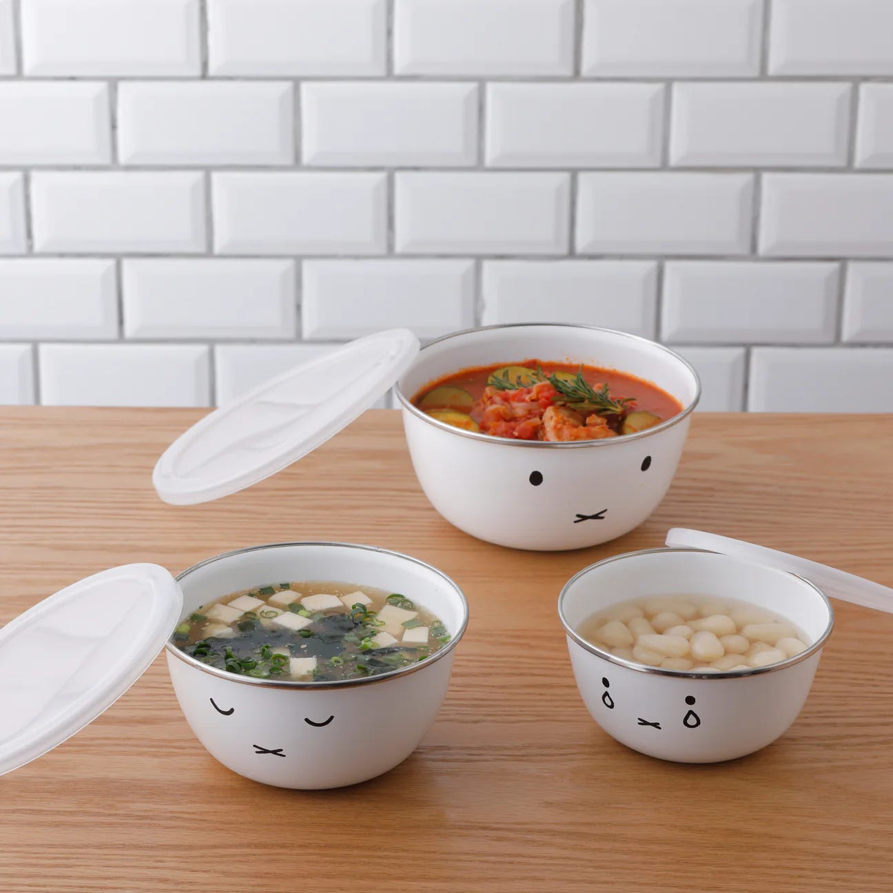 three mixing bowls with food 