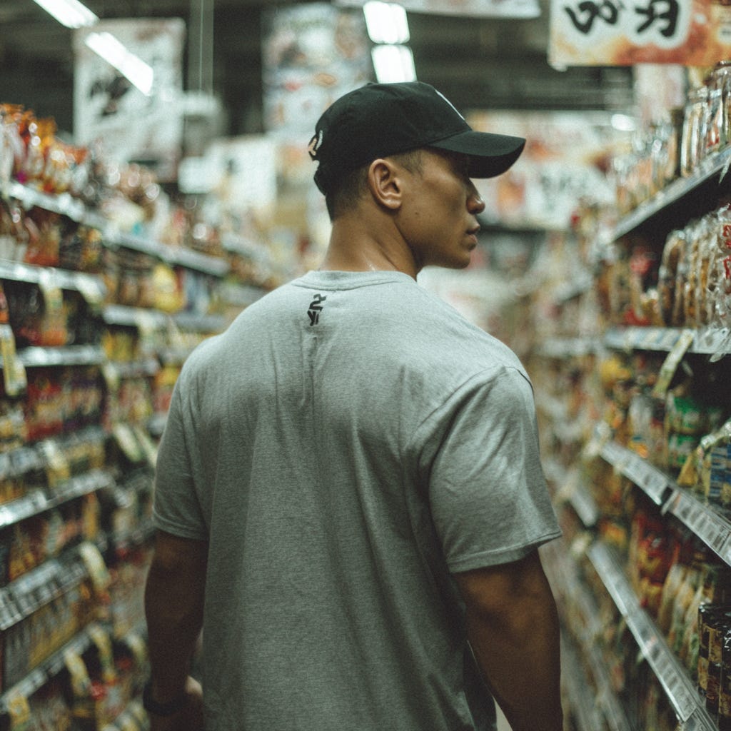 Massive, unit of a bloke shopping for animal protein in a japanese grocery store. Massive, unit of a bloke shopping for animal protein in a japanese grocery store.