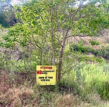 These are photos of the dry riverbed, the warning sign about diving, and the water conservation sign.