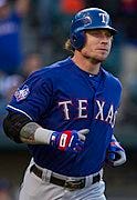 A baseball player wearing a blue uniform

Description automatically generated with medium confidence