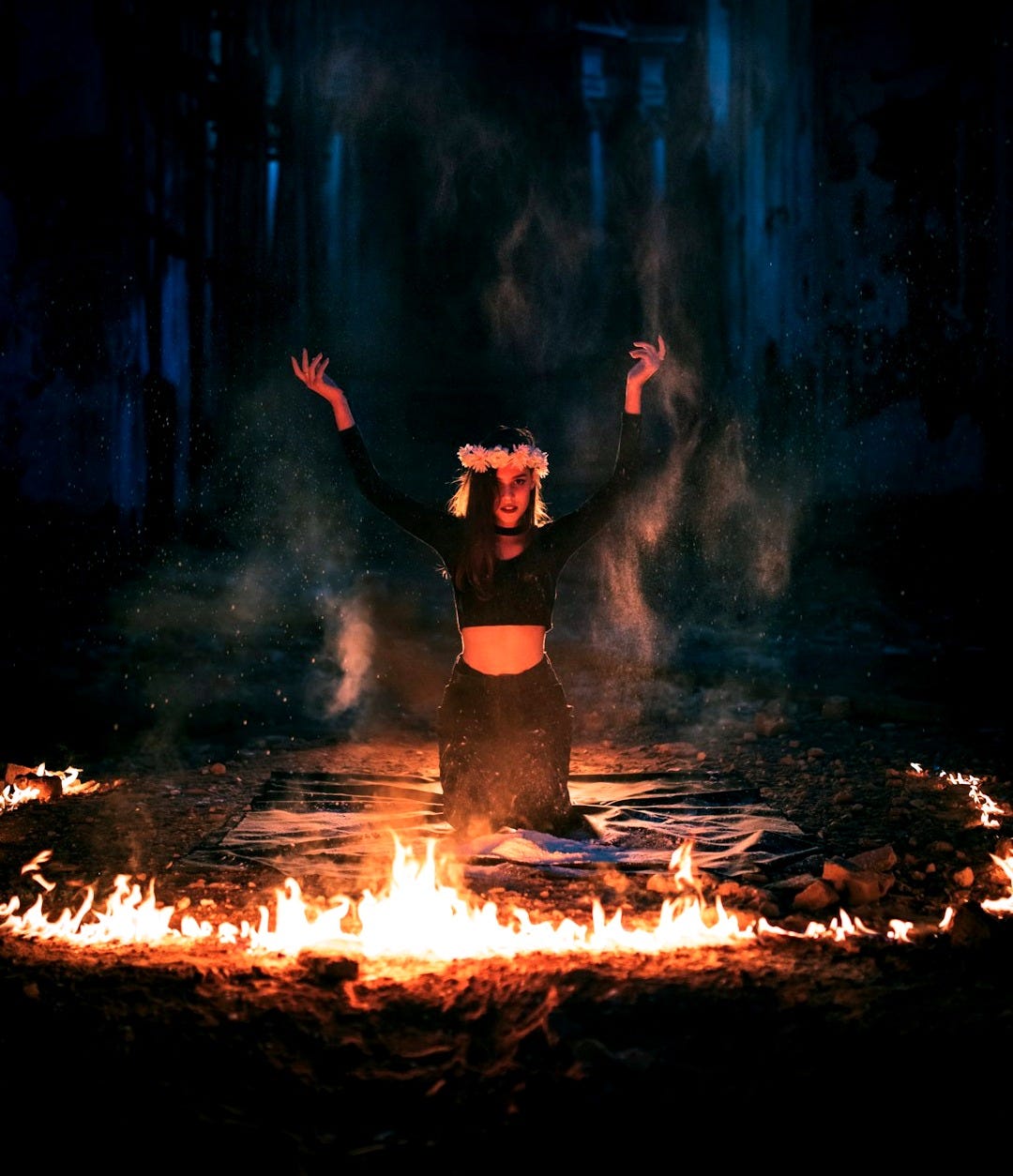 woman in black dress standing on fire