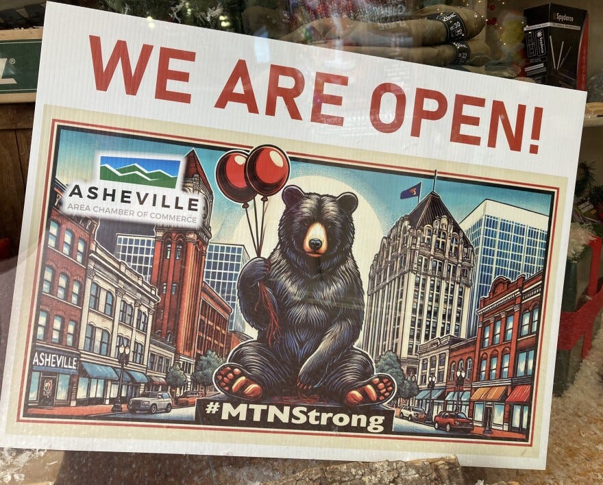 A sign in the window of a downtown Asheville store Tuesday, December 3, 2024.