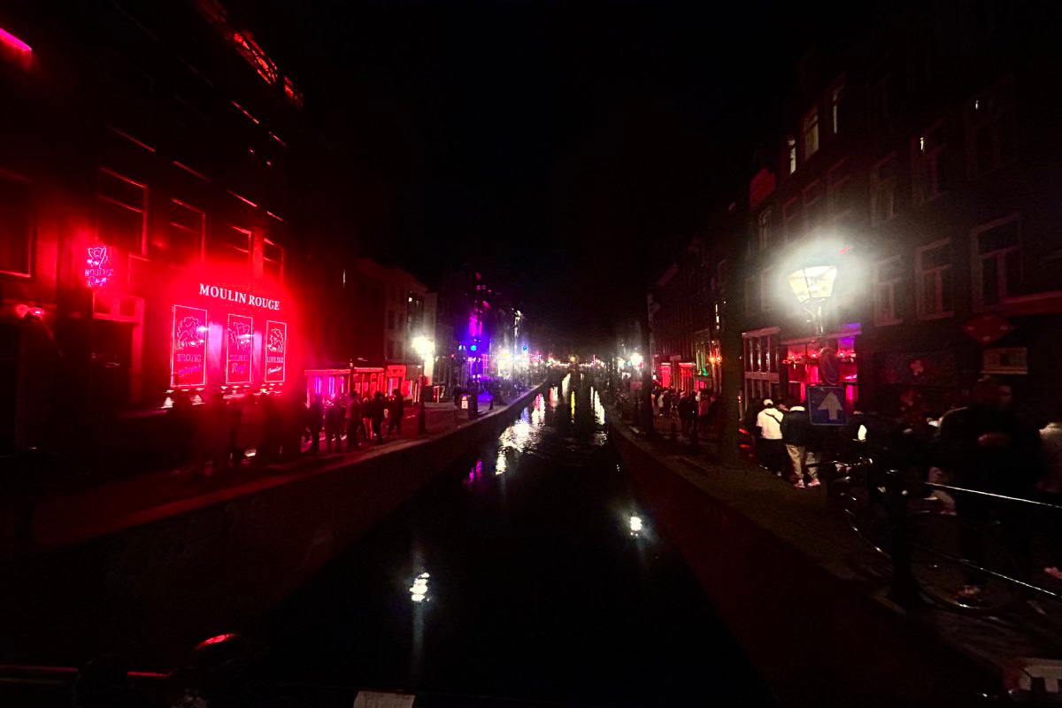 Night scene along a canal in Amsterdam. 