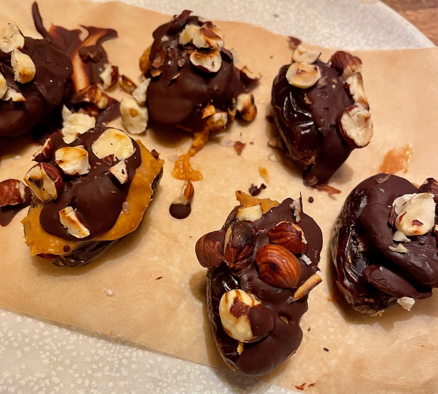 Dates covered in chocolate filled with peanut butter