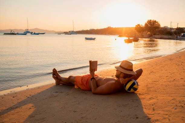 1,200+ Man Reading Book On Beach Stock Photos, Pictures & Royalty-Free  Images - iStock | Man relaxing on beach 1,200+ Man Reading Book On Beach Stock Photos, Pictures & Royalty-Free  Images - iStock | Man relaxing on beach