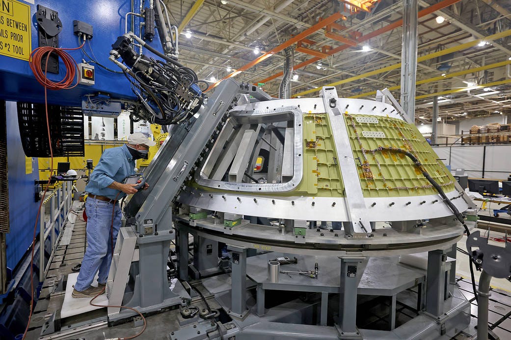 A technician views the Artemis III Orion spacecraft structure during welding activities A technician views the Artemis III Orion spacecraft structure during welding activities