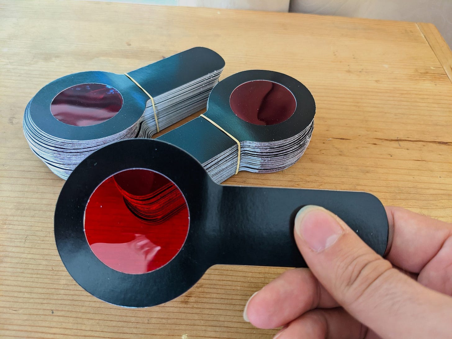 Stack of red filter decoder wands.