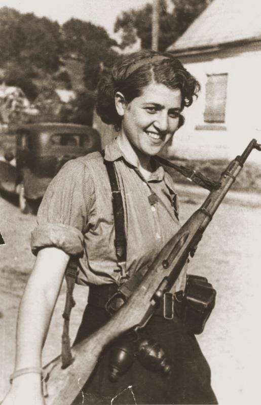 A powerful portrait of female partisan Sara Ginaite at the joyous liberation of Vilna, Lithuania, August 10, 1944.