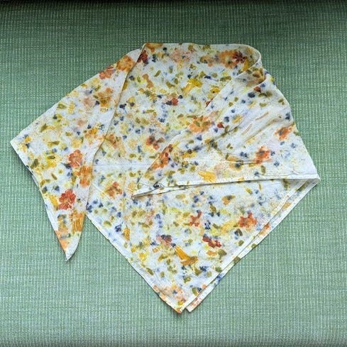 a colorful eco printed scarf, a cyanotype in process