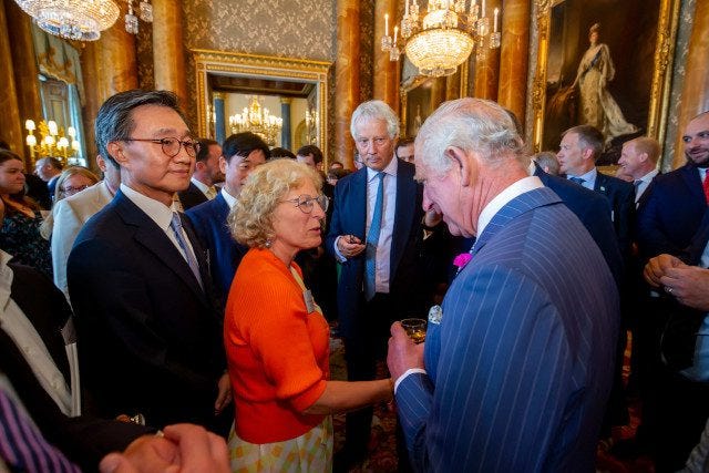 King Charles greets guests at the Astra Carta announcement event. King Charles greets guests at the Astra Carta announcement event.