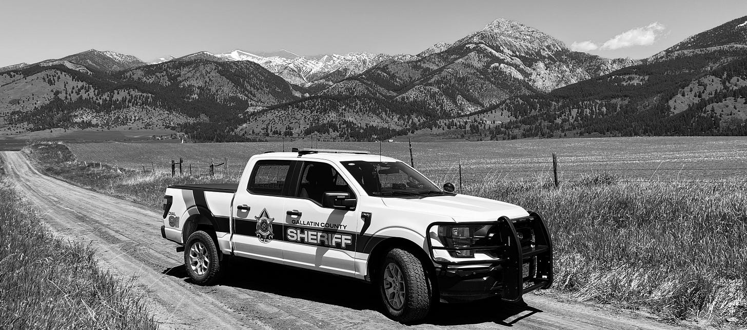 May be a black-and-white image of road and text that says 'E ALLATINC SHEI TY FF'