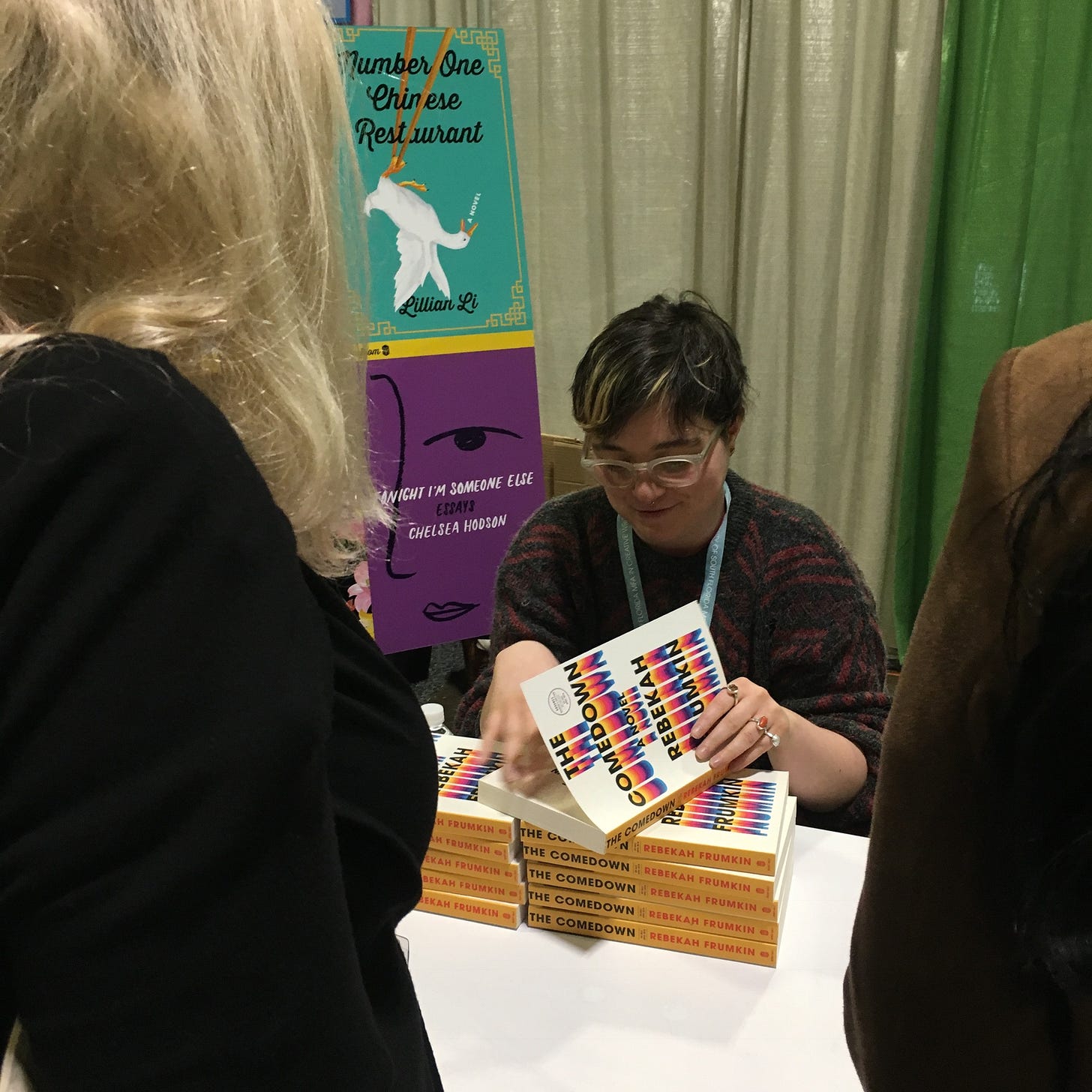 Me signing books at AWP in 2018