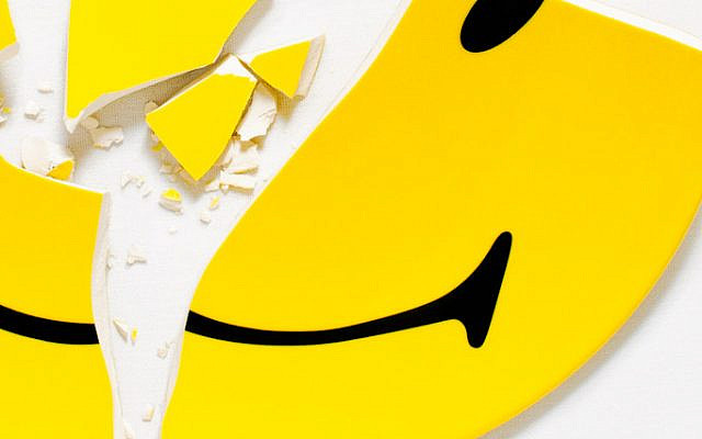 A shattered smiley face emoji. A shattered smiley face emoji.