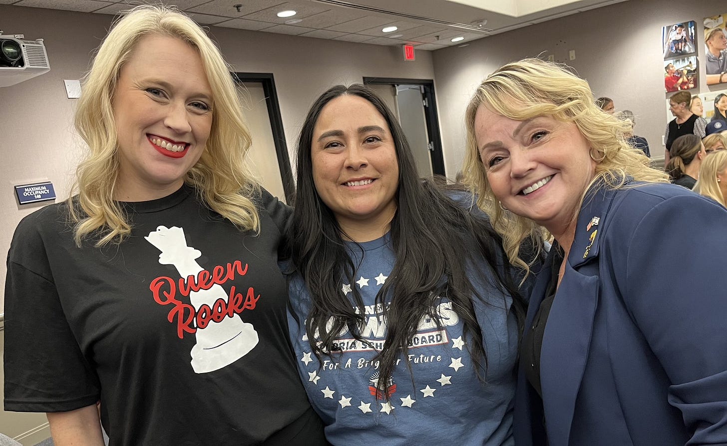 PUSD Board members Heather Rooks and Janelle Bowles. Rooks wears a shirt with a chess piece on it that says Queen Rooks