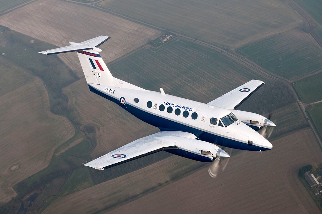 A Royal Air Force Beech King Air B200 in flight over the English countryside A Royal Air Force Beech King Air B200 in flight over the English countryside