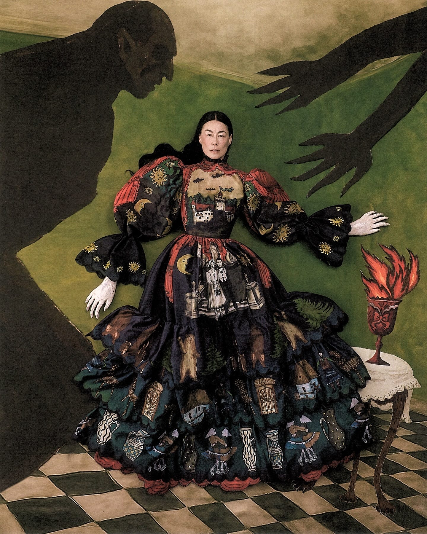 Szilveszter Mako photograph of a woman in a hand-painted layered dress with a dark shadow   figure and checkered floor