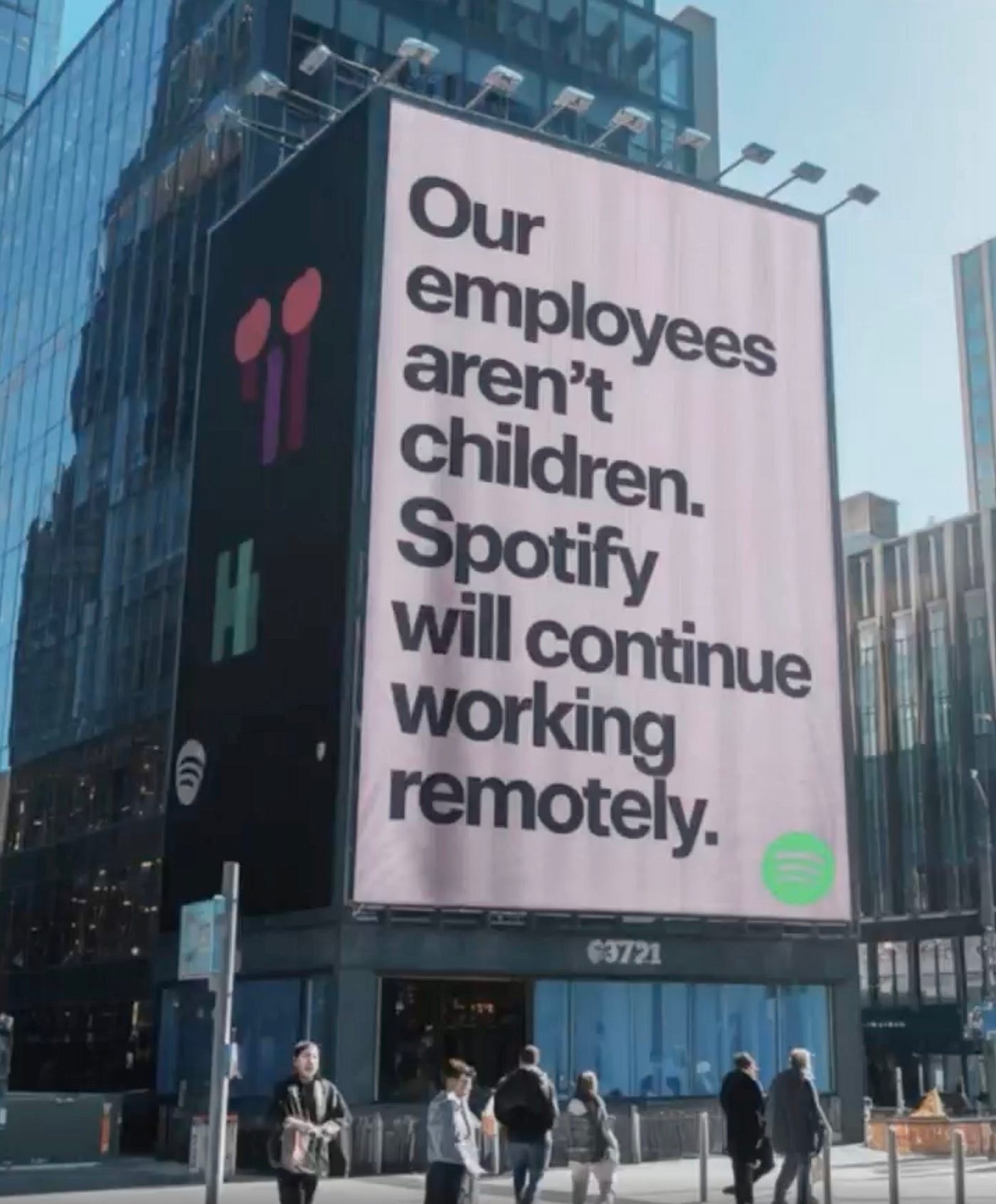 IMAGE: A billboard from Spotify stating “Our employees aren’t children. Spotify will continue working remotely”