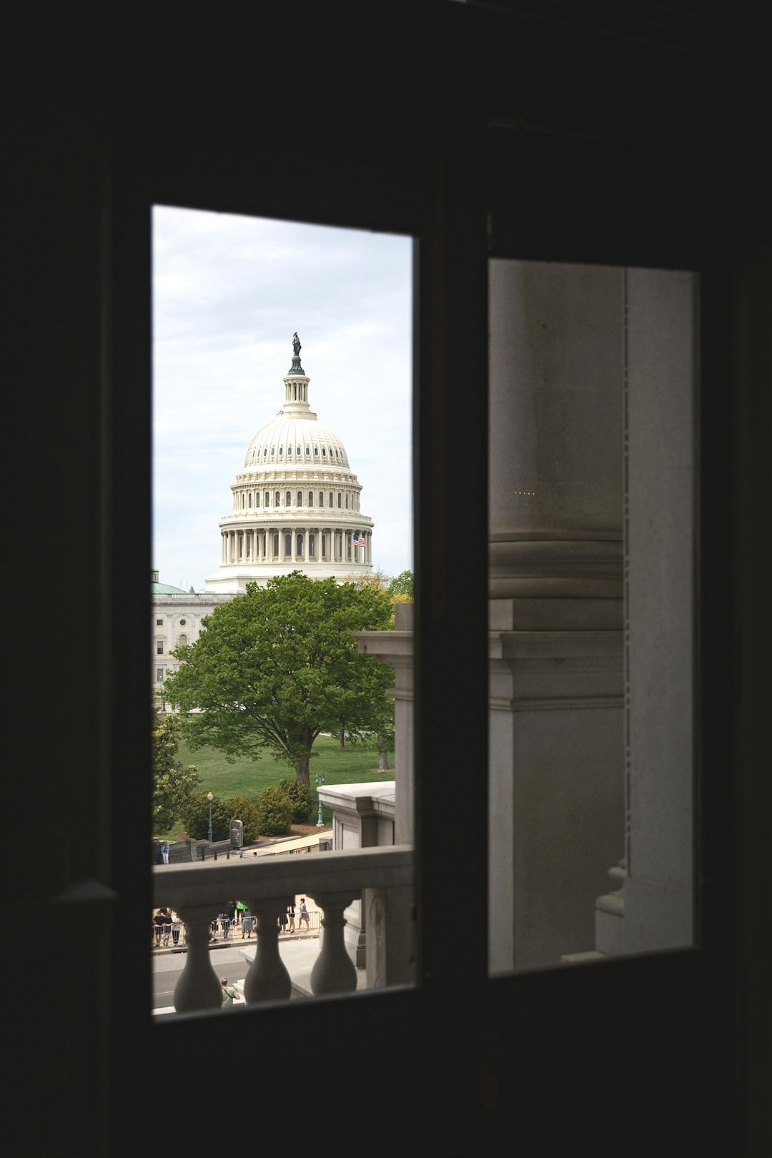 A view of the capitol building from a window A view of the capitol building from a window