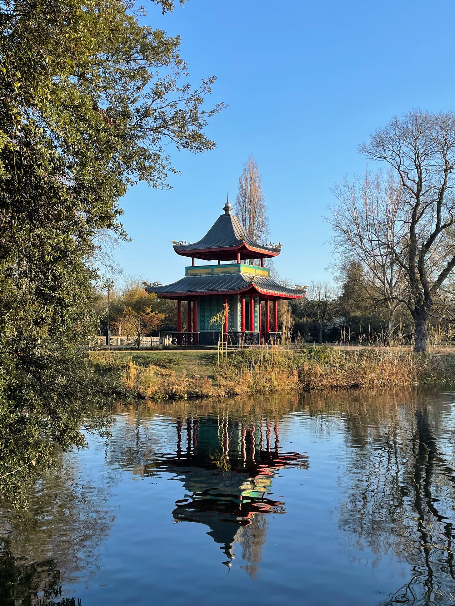 The Chinese Pagoda, Victoria Park, east London reflected in the water