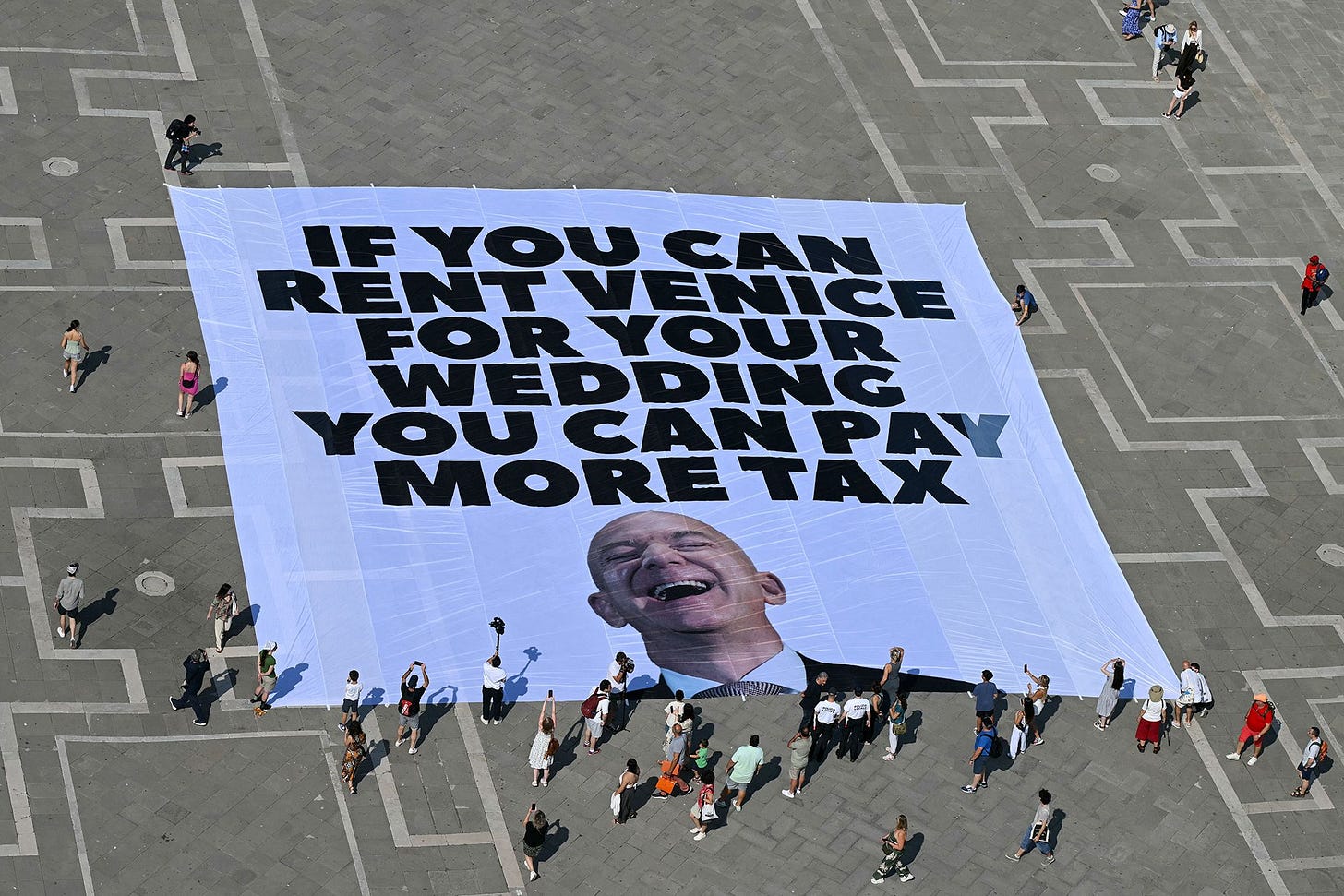 Greenpeace activists unfurled a gigantic banner in Venice days ahead of Jeff Bezos' wedding in the city.