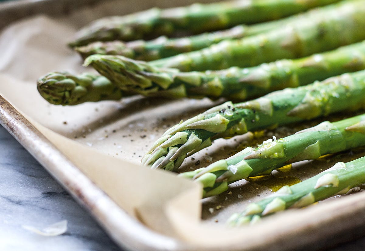 Close up of sheet pan with asparagus spears Close up of sheet pan with asparagus spears