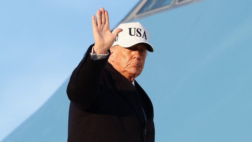 Donald Trump waves as he boards Air Force One. Donald Trump waves as he boards Air Force One.