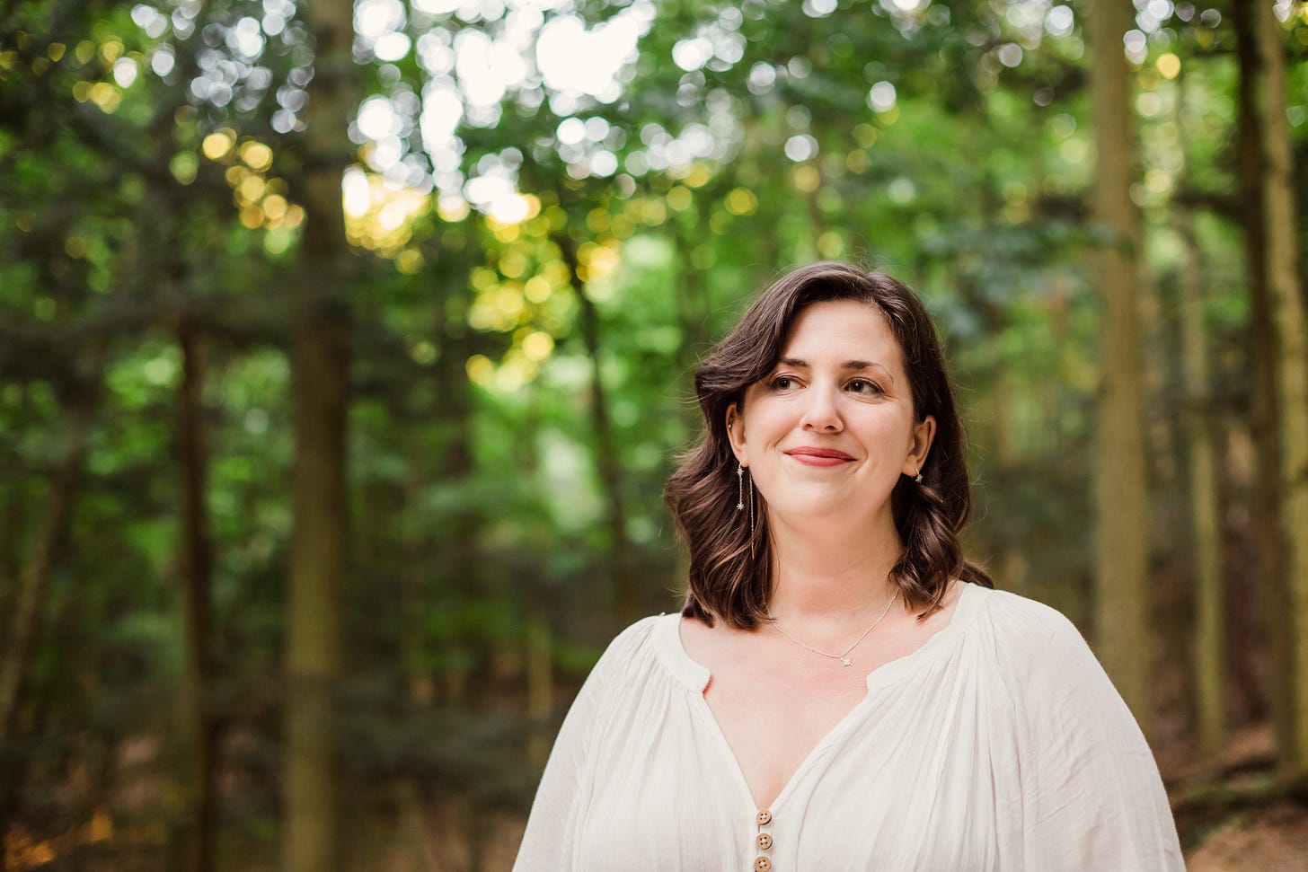Cait West in the forest