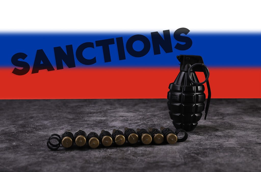 Rifle bullets and granade with flag of Russia and Sanction… | Flickr