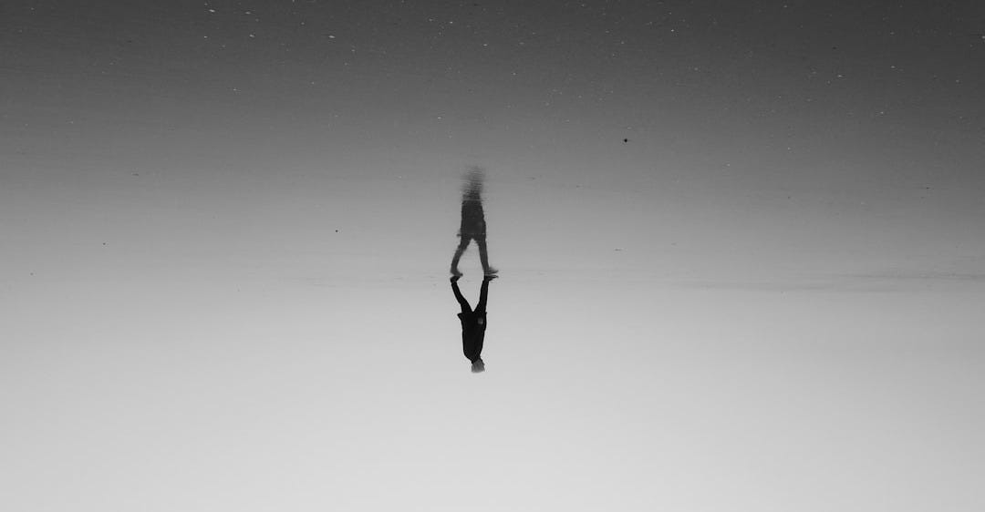 a person standing in the middle of a body of water